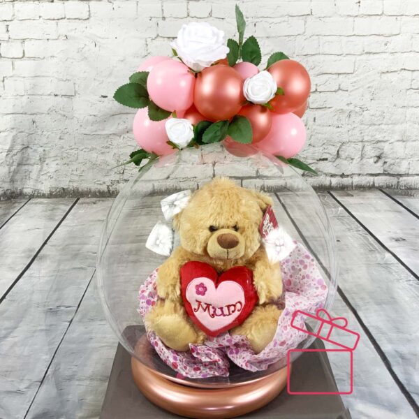 Adorable Surprise: Mother's Day Clear Balloon with Teddy Bear Inside Introducing our enchanting Mother's Day surprise: a Clear Balloon adorned with a cuddly Teddy Bear, topped with delicateflowers and balloons.